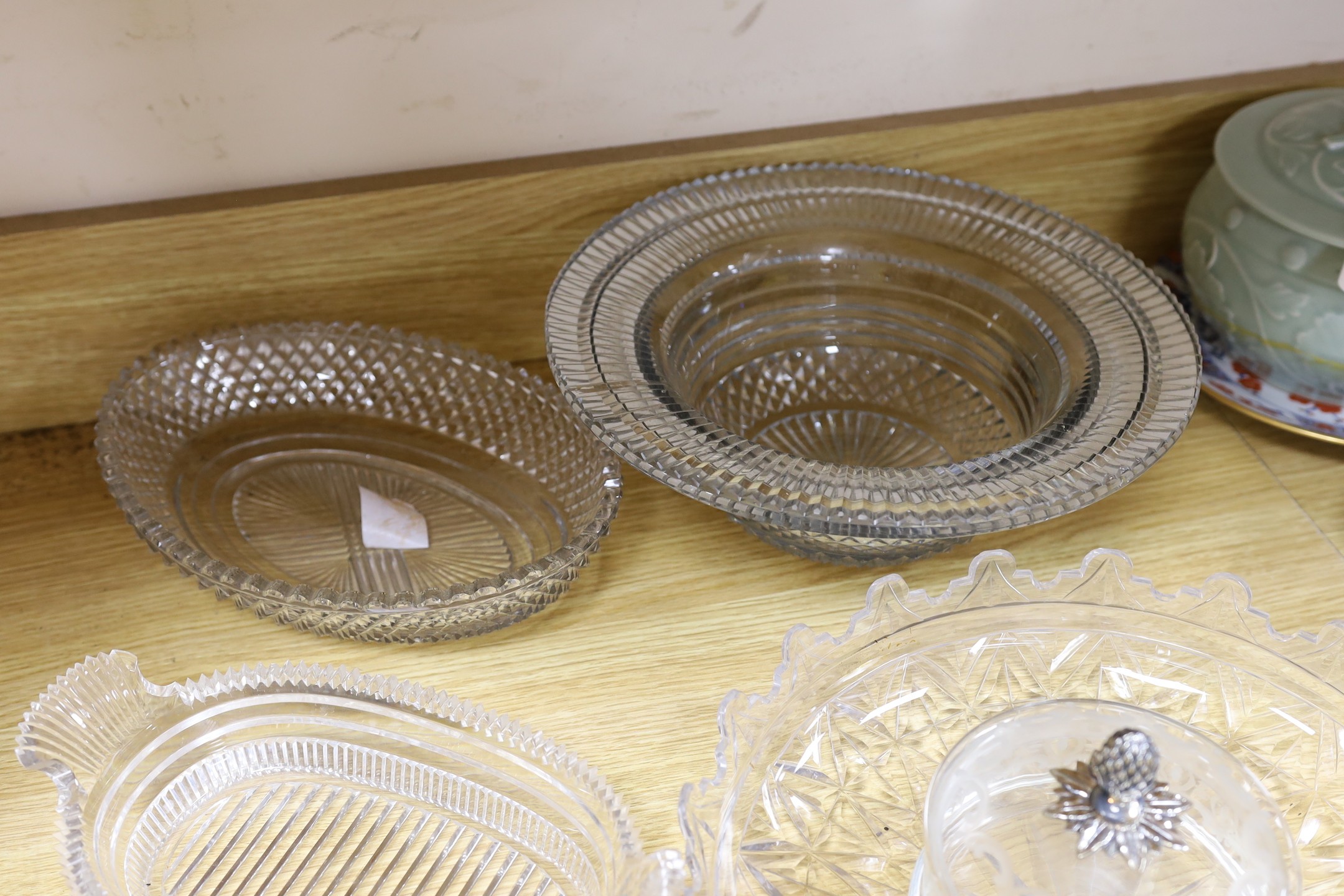 A selection of various late Georgian cut glass dishes, and a later silver mounted pineapple lidded pot and others